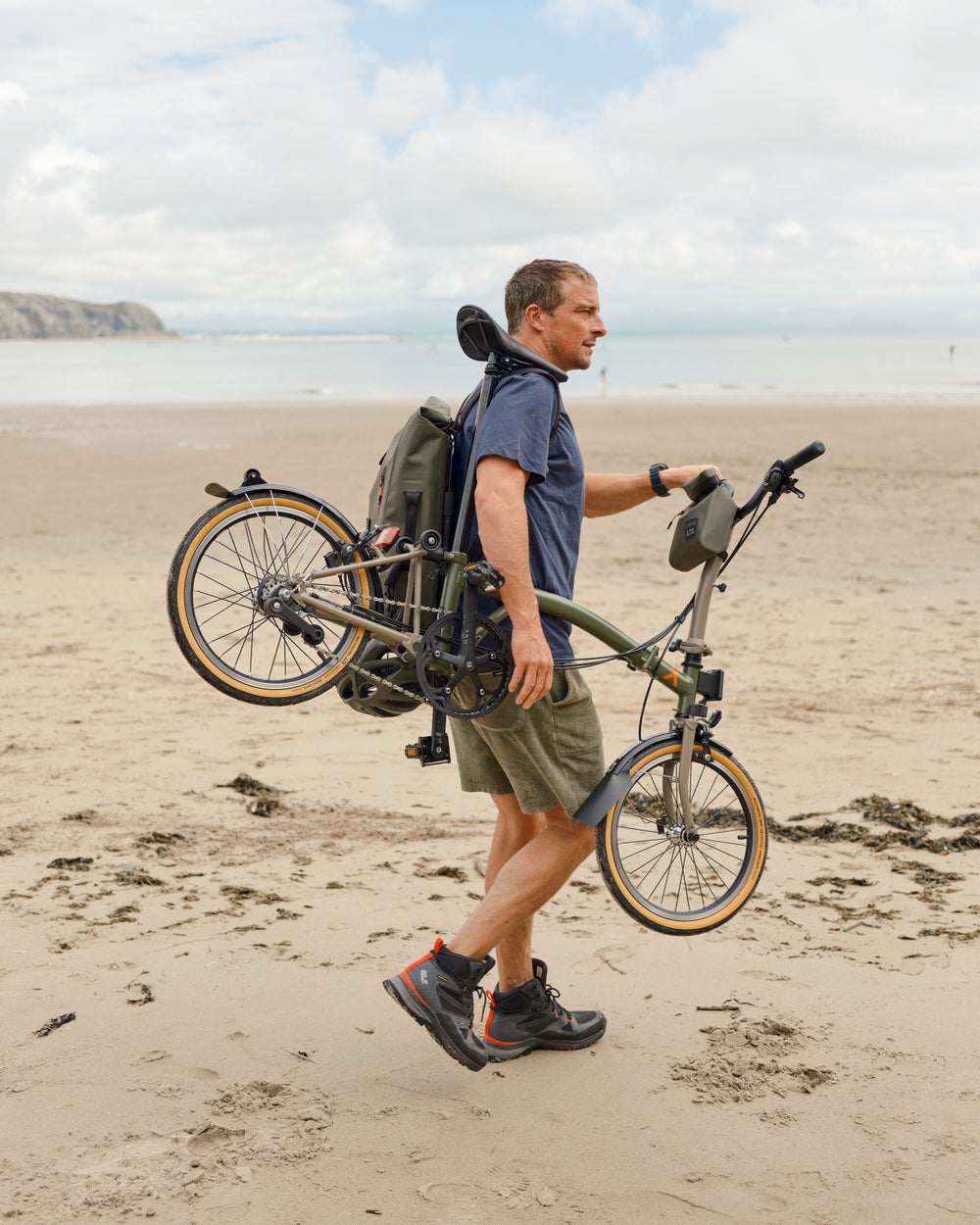 Bear Grylls with the Brompton x Bear Grylls folding bike