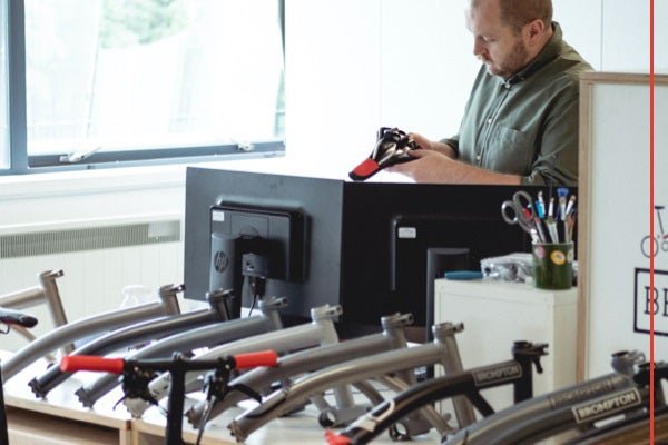 Andrew Finkell testing the saddle of a Brompton x CHPT3 2020 edition bike