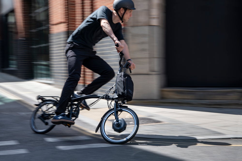 A person riding a Brompton Electric P Line