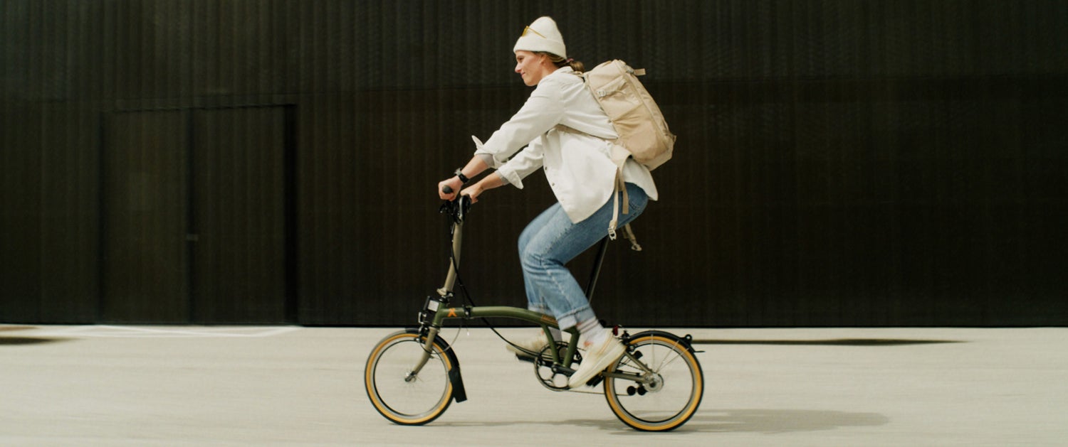 Clara Johanna riding her Brompton x Bear Grylls folding bike