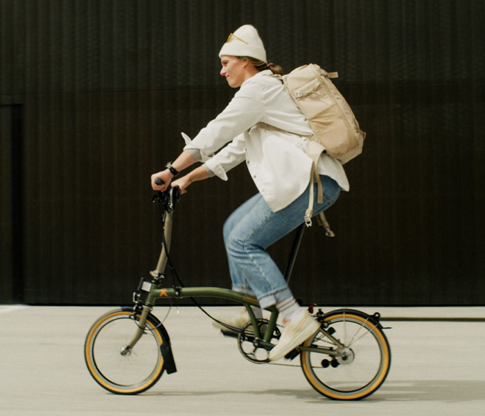 Clara Johanna riding her Brompton x Bear Grylls folding bike