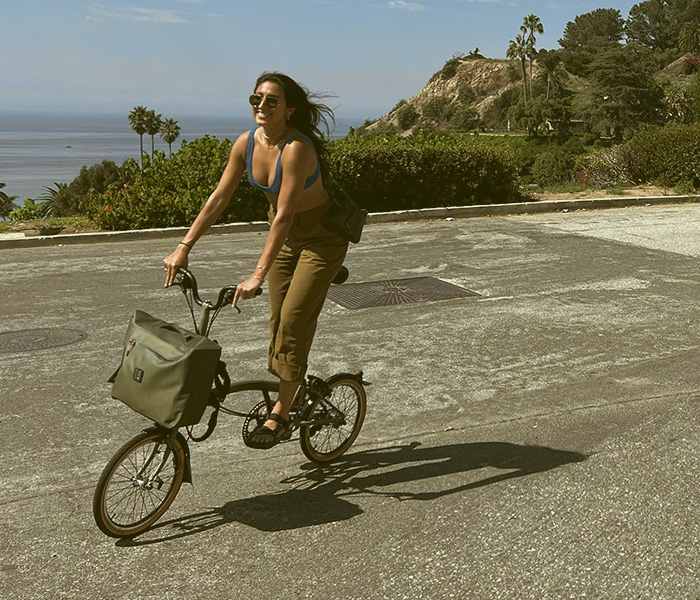 Diandra Esparza riding her Brompton x Bear Grylls folding bike