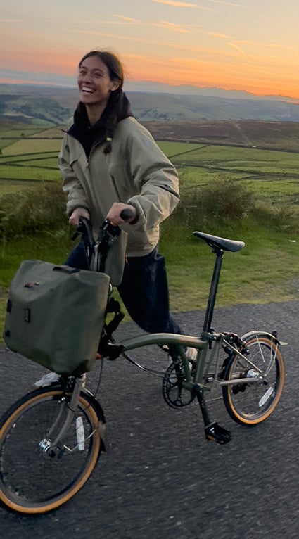 Model and climber Eugenie Lee on her Brompton x Bear Grylls folding bike