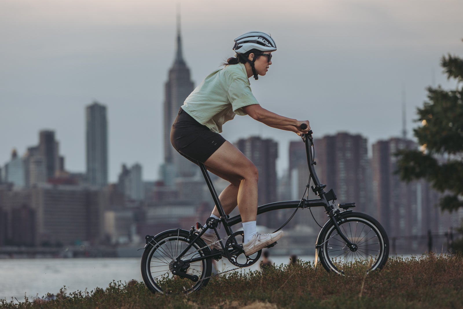 A person riding a Brompton through NYC